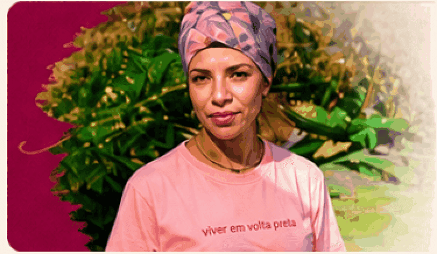 Chef Naná Rodrigues de turbante e camiseta rosa em um jardim